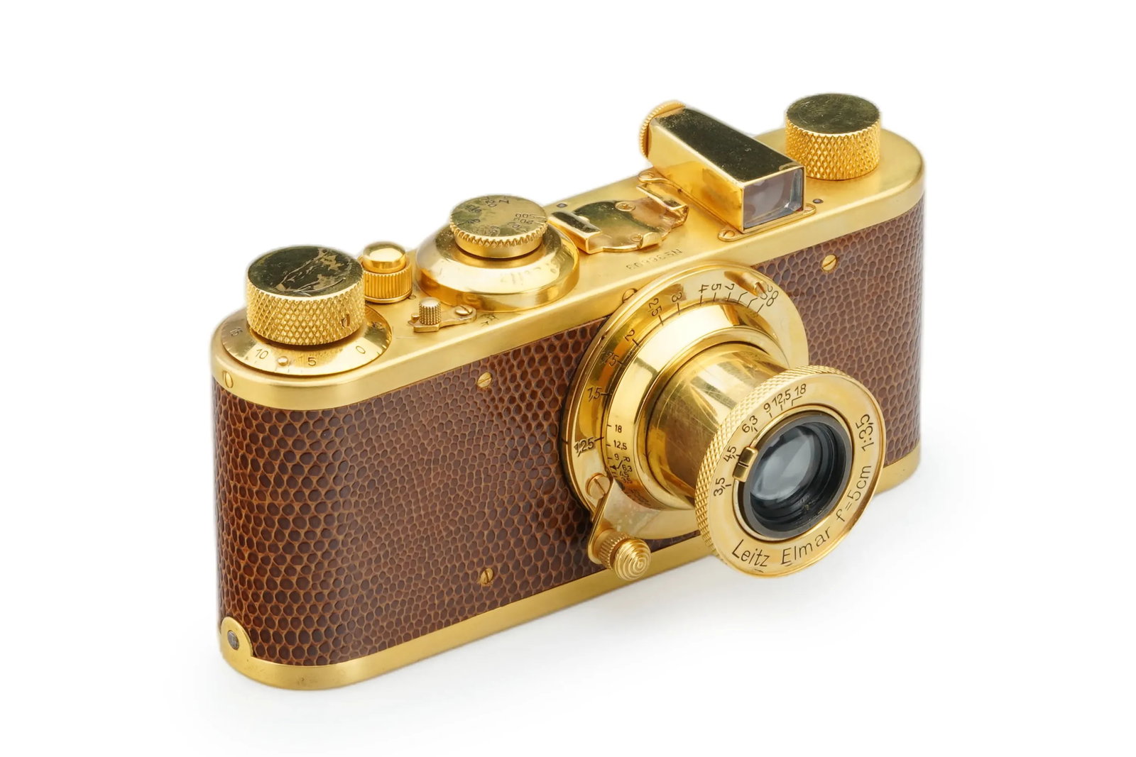 Leica I Mod. A Re-plated gold: Replated in gold with brown reptile skin leather, this decorative Leica I Mod. A is paired with a matching gold-plated Elmar 3.5/5cm lens. The optics remain clean, showing only minimal cleaning marks