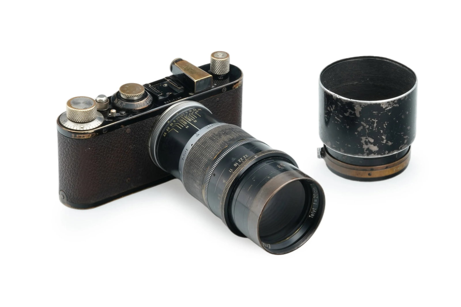 Leica Standard Black Paint: This Black Paint Standard is offered in good working order, showing normal signs of use. It is paired with a Telyt 4.5/20cm(No. 768598)featuring good optics and its matching lens hood.