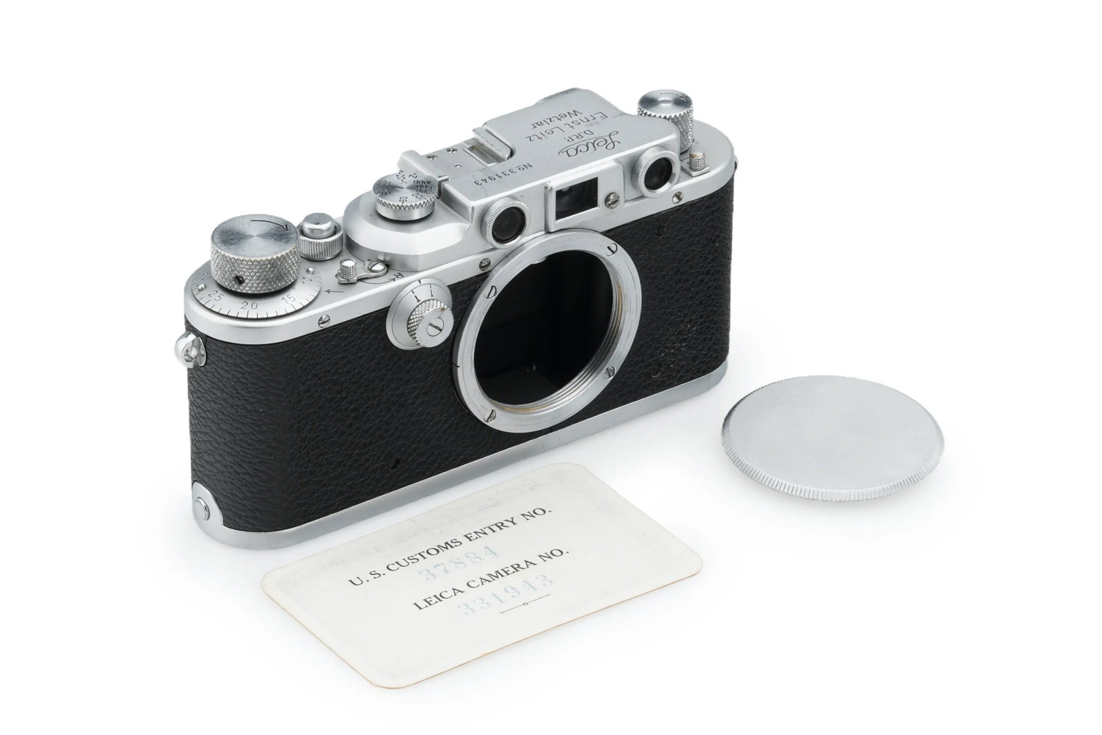 Leica IIIb Chrome: Preserved in beautiful condition and full working order, this Leica IIIb chrome comes with a matching New York import certificate card and a body cap.