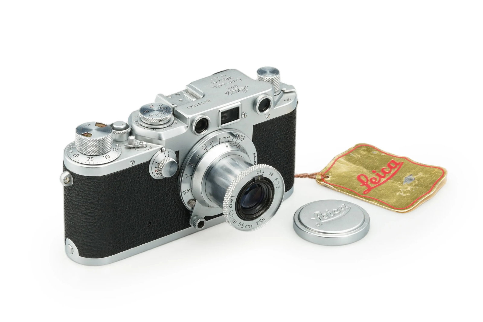 Leica IIIf with Elmar 3.5/5cm: This Leica IIIf is presented in very nice condition and full working order, paired with an Elmar 50mm lens(No. 633976)featuring clear optics with only minimal dust. It is accompanied by its front