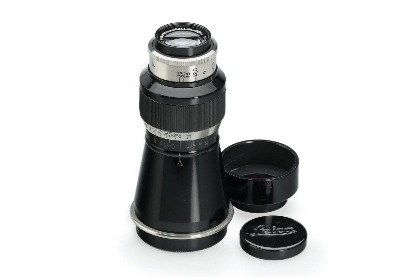 Leica Elmar 6.3/10.5cm Black/Nickel 'Mountain Elmar': This rare and early ELZEN "Mountain Elmar" is presented in mint condition with a classic black and nickel finish and a meter-scale focus ring. Optics are clear. The set is complete with its original