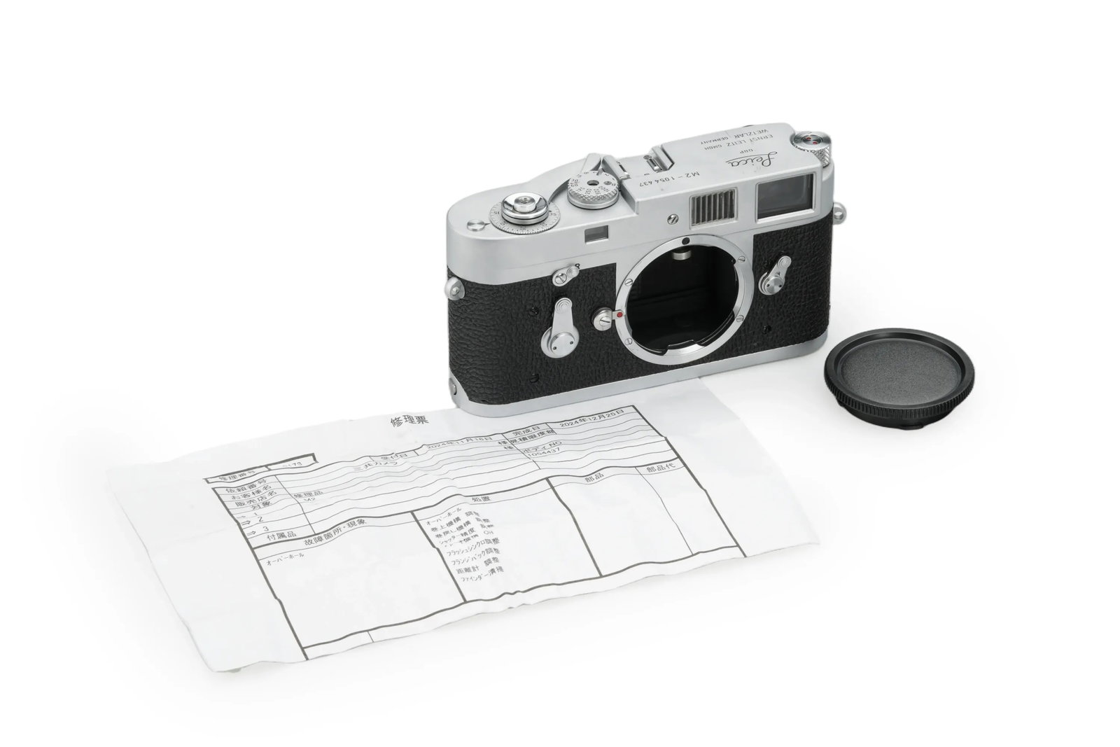 Leica M2 Chrome: This near-mint Leica M2 in chrome is a beautiful unit of the iconic rangefinder, currently in full working order. Documentation is included in the form of a certificate confirming that its