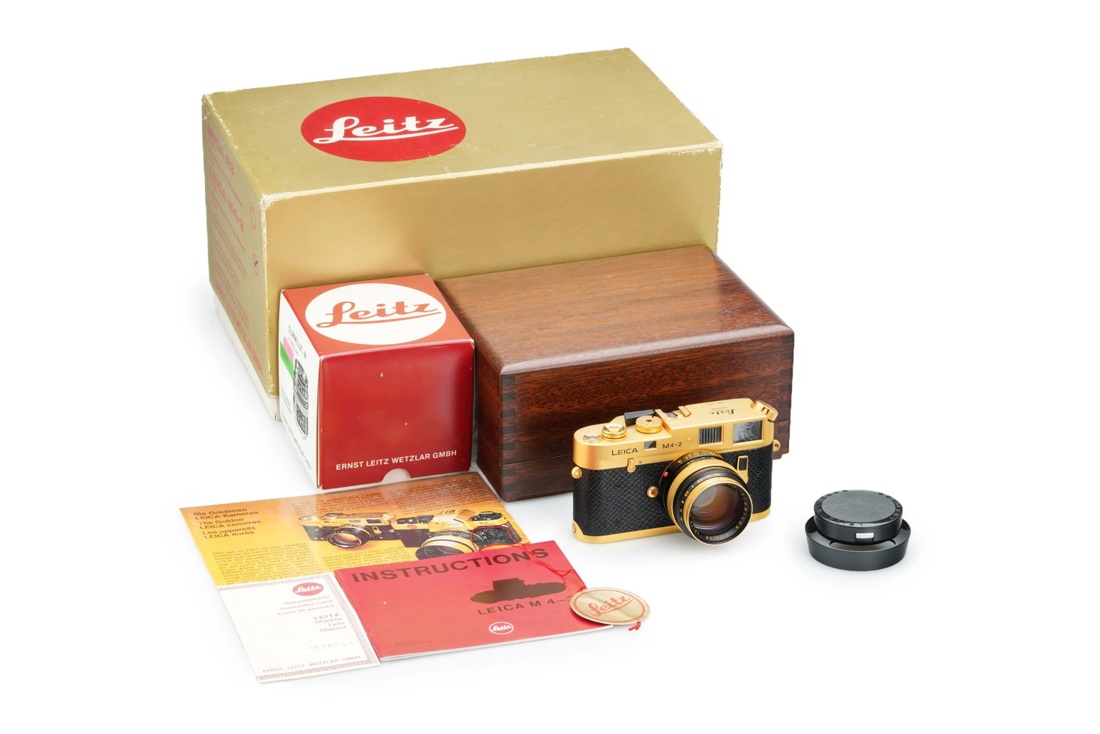 Leica M4-2 Gold 'Oskar Barnack' Set: Issued to commemorate the centenary of Oskar Barnack's birth, this limited gold-plated edition is one of only 1,000 units produced. The camera(No. 1528473)features a black reptile-skin covering and sh