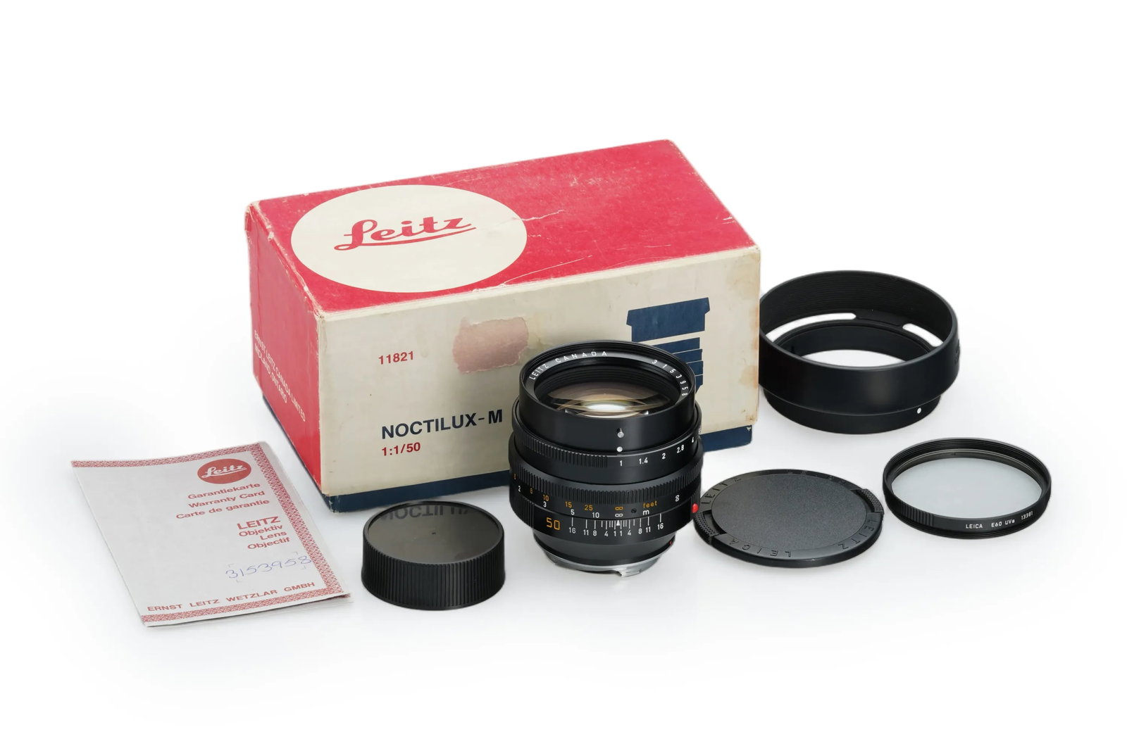 Leica Noctilux-M 1/50mm 11821 E60: A very mint second-type Noctilux 50mm E60 with clear optics. This set includes the matching hood 12539, both lens caps, and the matching maker's box.