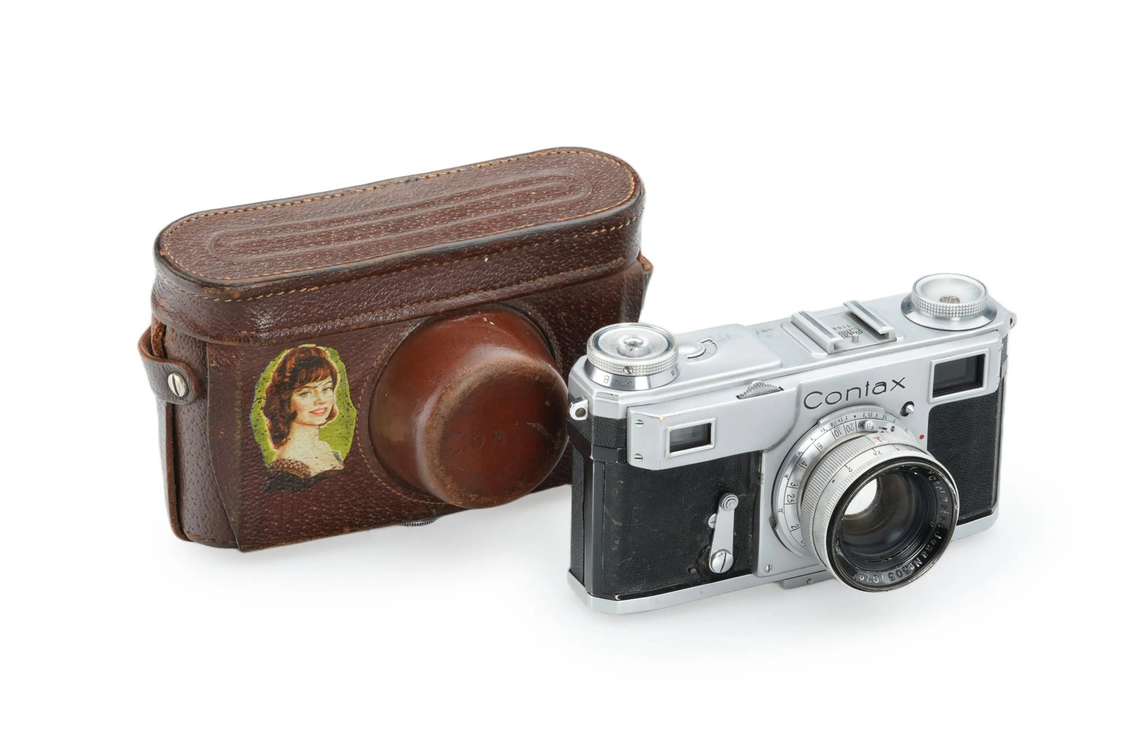 Contax Jena: A Jena-made Contax II remains in good condition and working order is accompanied by its matching back door. It comes with a coated Sonnar 2/5cm(No. 3051070)with typical cleaning marks on the front