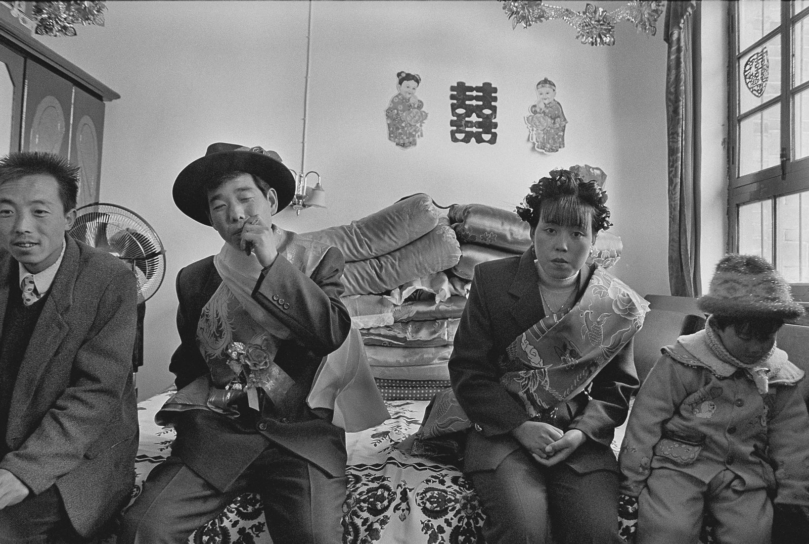 Newlyweds: Location: A farmhouse in Fengxiang County, Shaanxi Medium: Hand-made silver gelatin print Edition: Limited edition of 1/6 Framing: Framed Signature: Signed by the artist Newlyweds was photographed in