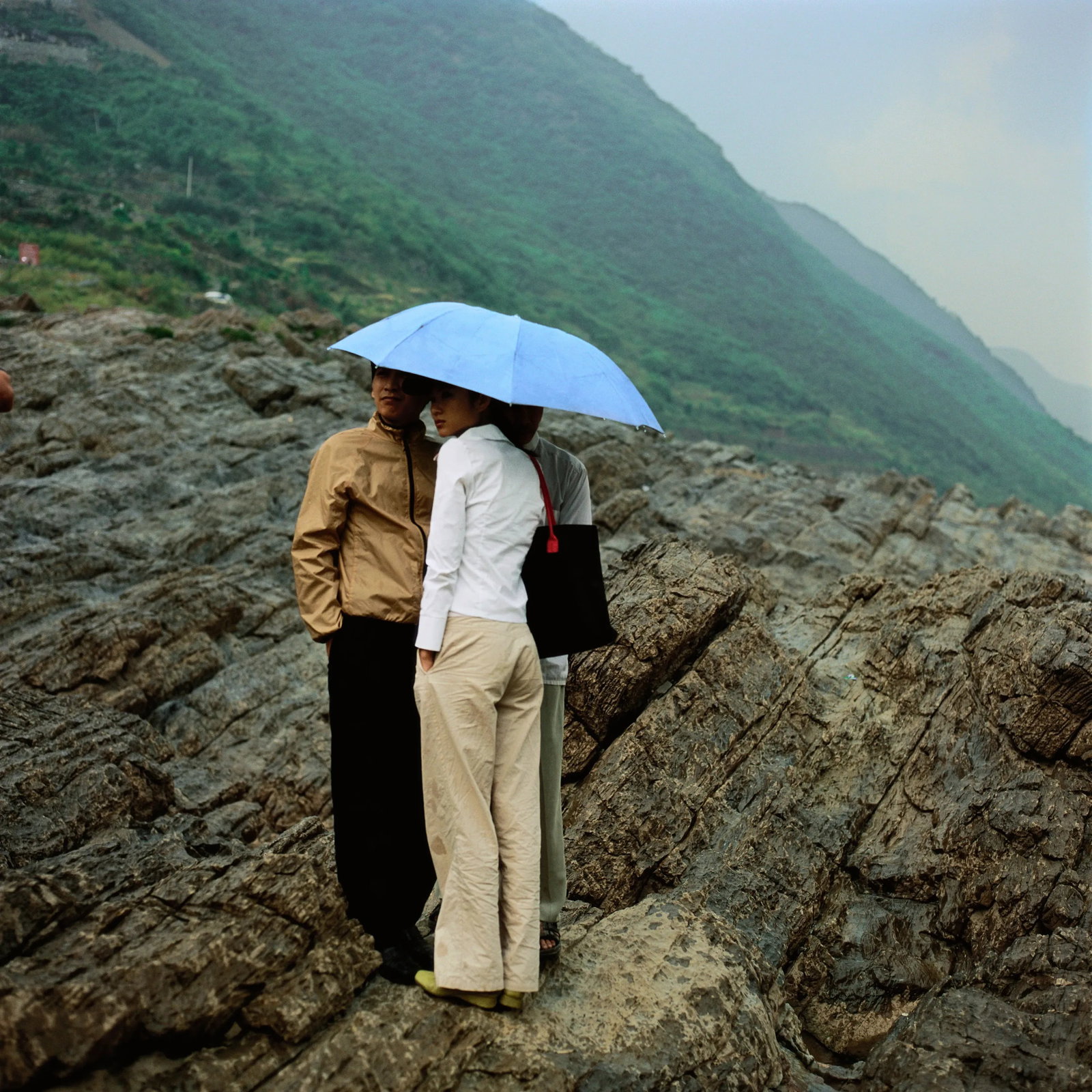 Three Young People Waiting for a Boat: Series: Three Gorges Series No.02; Humanism in China, No.038 Print Date: 2026 Location: Qingshi Village, Wushan County Medium: Archival print Edition: AP 2 For the artist, the Three Gorges is both his