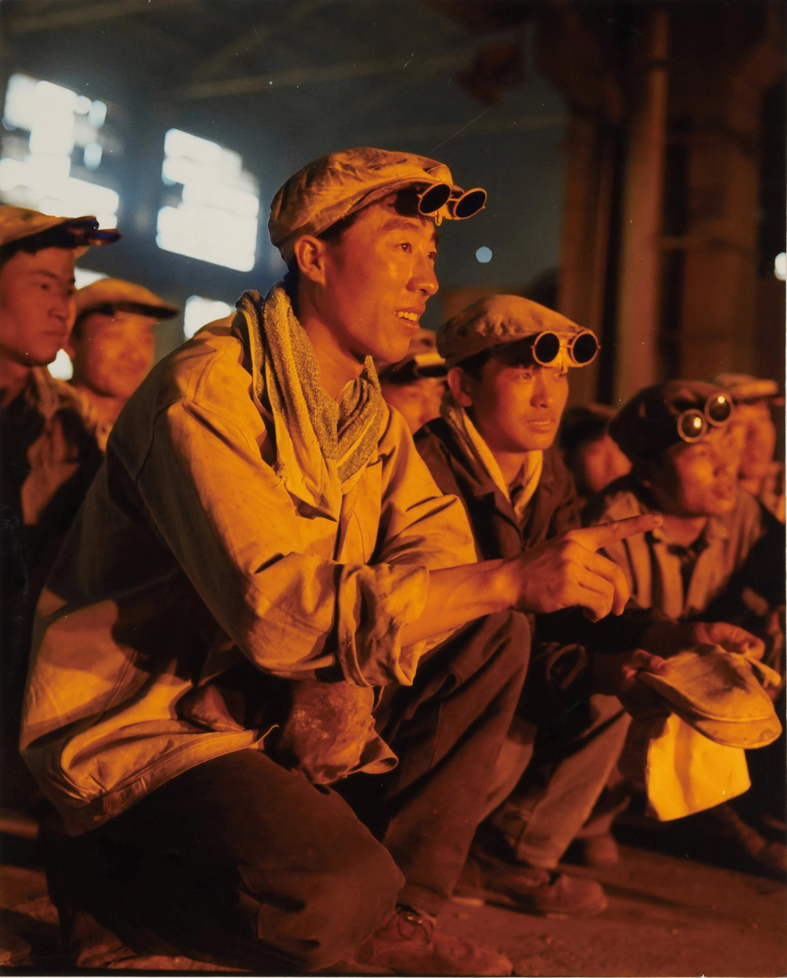 Steelworkers at Anshan Iron and Steel Plant: Medium: Kodak chromogenic print Signature: Signed by the artist Steelworkers at Anshan Iron and Steel Plant was photographed in 1973, depicting a moment of coordinated work by steelworkers inside a st