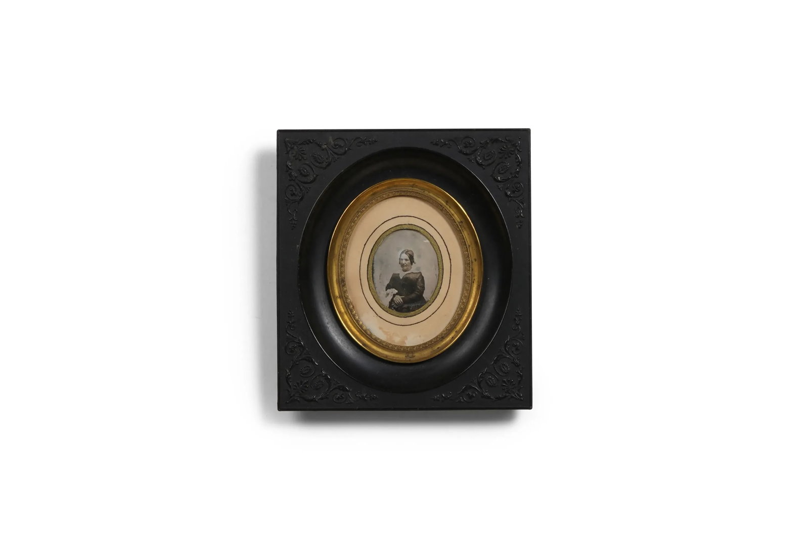 Early Daguerreotype Miniature Portrait: Medium: Early daguerreotype, framed Framing: Black embossed frame with gilt oval liner Back Inscription: Handwritten French inscription, legible in part as "Mme ... nee Francoise Ste Marie d'Aubigny, 