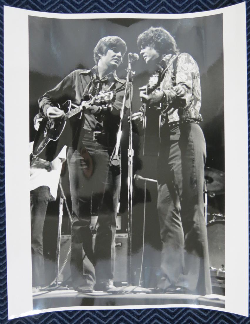 Everly Brothers 11 x 14 Photo by Joe Sia: By the famous Woodstock and Rock n Roll photographer Joe Sia. Stamped on the back. Mint. The light colors that you see are glare from the camera lights, the background is solid black.