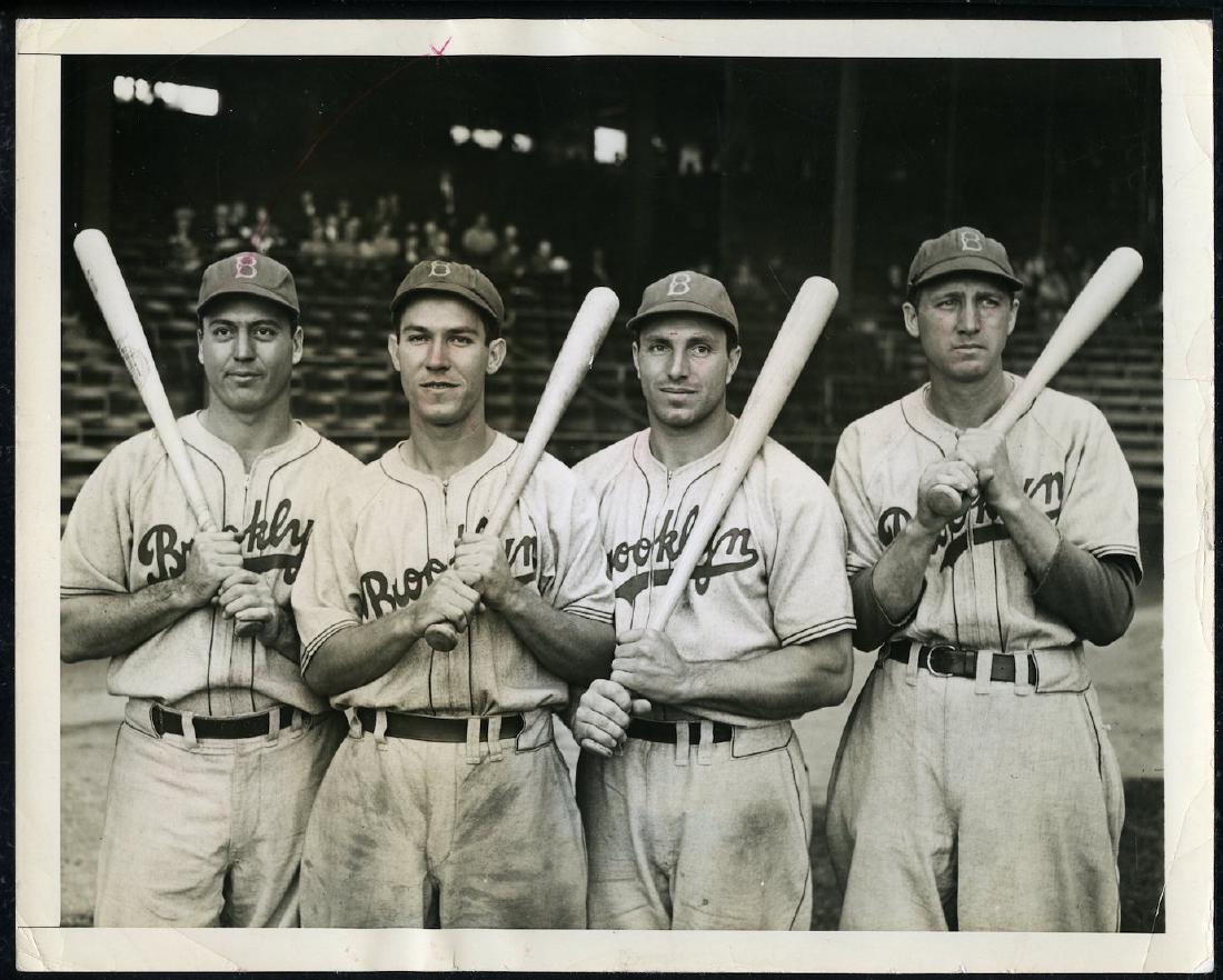 1941 Brooklyn Dodgers Players Baseball Press Photo: Dated 10/14/41. Pictures Billy Herman, Pete Reiser, Dolf Camilli and Dixie Walker. 7 x 9. Very Good.