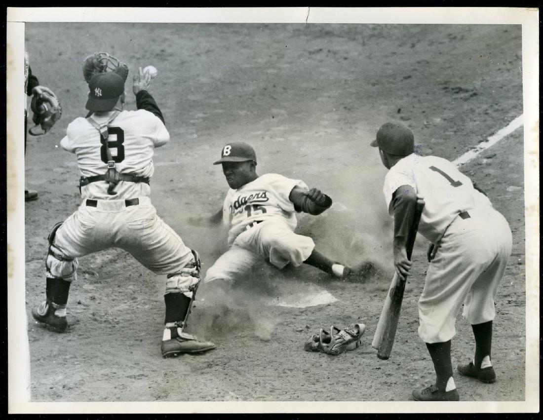 1955 World Series Baseball Press Service Photo: Sandy Amoros of the Dodgers slides into home while Yogi Berra waits for the throw. Dated 10/1/55. 7 x 9. Excellent condition.