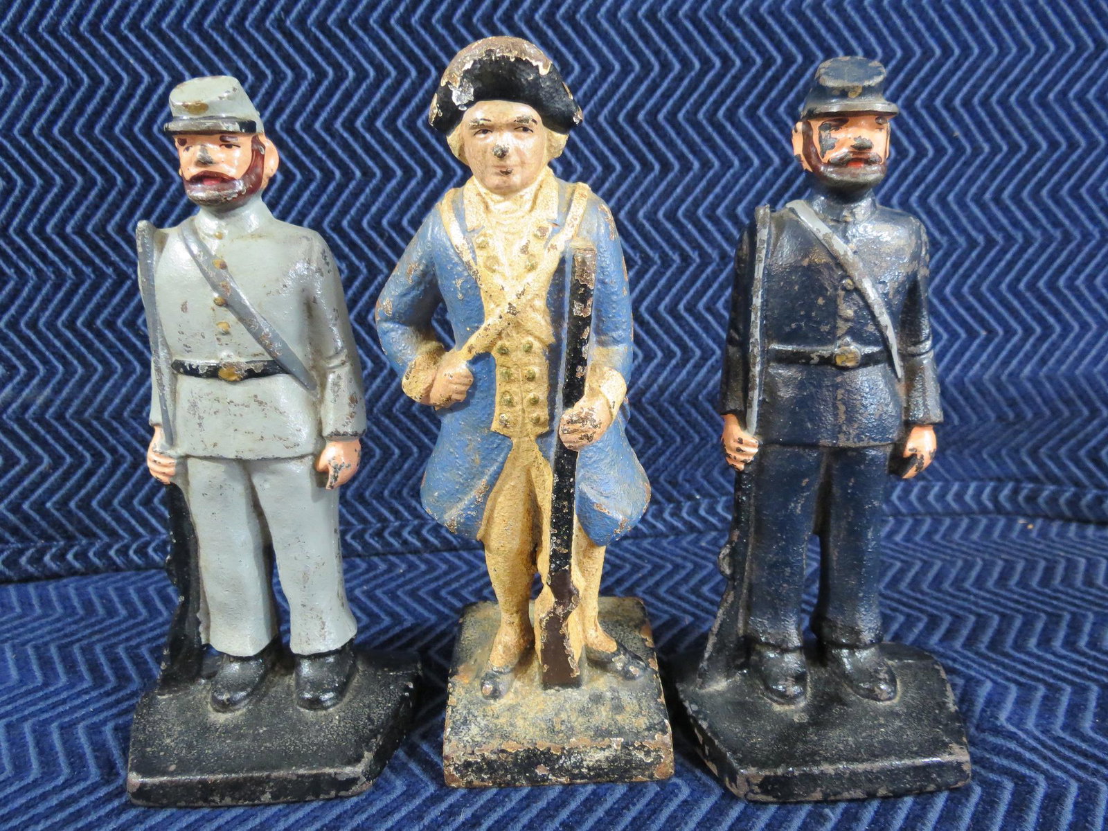 (3) Cast Iron Soldier Door Stops: Lot of (3). Includes Revolutionary War Soldier, Union Soldier and Confederate Soldier. All about 7 inches tall. Very Good condition.