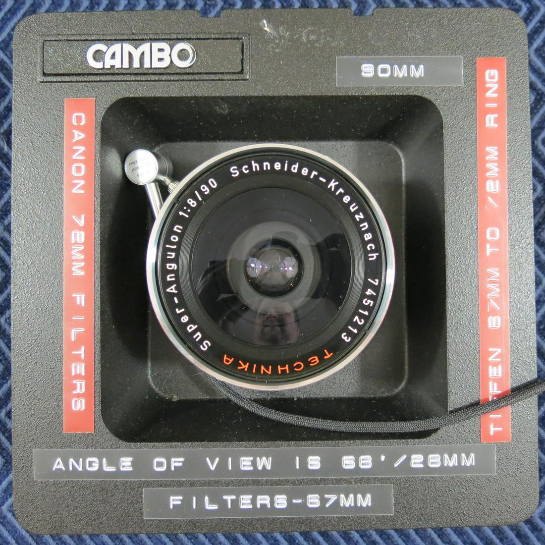 SCHNEIDER SUPER ANGULON 90MM F/8 TECHNIKA FOR 4X5 FOR: The photographer affixed his own labels to remind him of the specs. Affixed to Cambo recessed lens board. Fine condition. No mold in the lens. Basically like new.