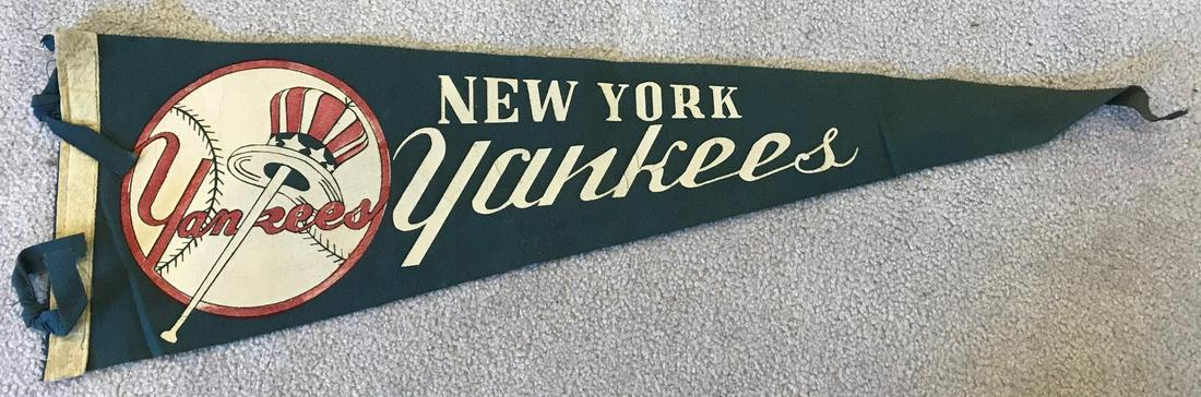 1940s NEW YORK YANKEES Full Size Soft Pennant: This New York Yankees pennant measures 26 inches long and 8 inches from top to bottom on the right hand side where the reinforced felt is. Â Given the age of this item it is in very good condition b
