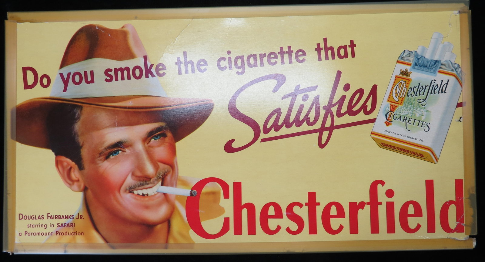 1940 Trolley Cardboard Sign Chesterfield Cigarettes Douglas Fairbanks Jr: Appx 11 x 21" on cardboard. There are several edge tears and some wrinkles. Somewhat fragile, but displays nicely. We offer in house shipping for this item or you can arrange to pick it up at our Sout