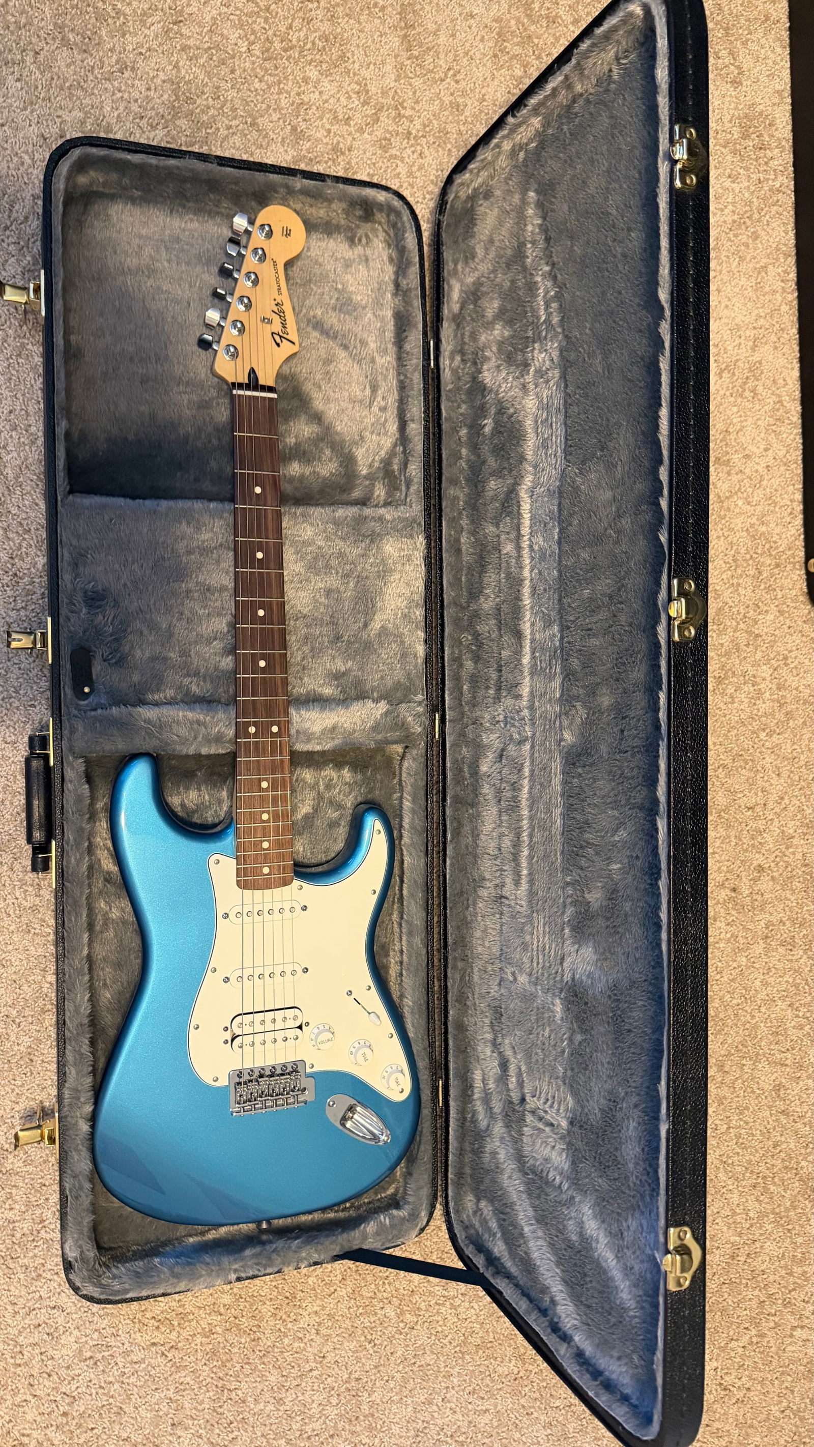 Stratocaster Maple Fingerboard Electric Guitar Blue: Blue Strat (Lake Placid Blue):Model: Fender Standard Stratocaster (Made in Mexico)Serial Number: MX15636490Neck: Maple neck with rosewood fretboardBody: Likely AlderPickups: HSS configurationCase: Cla