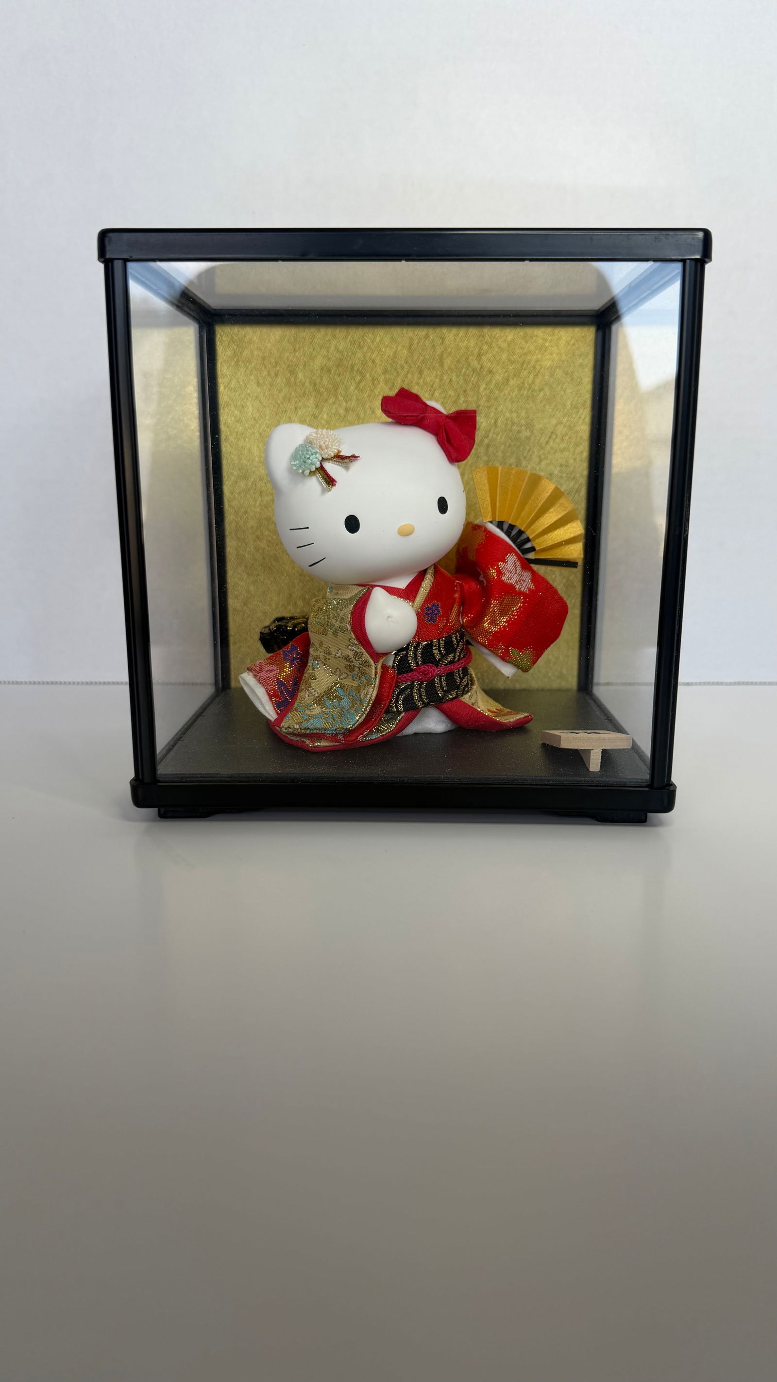 Limited Edition Hello Kitty in Traditional Japanese Kimono, with Display Case: An utterly charming and elegant collectible figurine of Hello Kitty dressed in a traditional Japanese kimono, presented in a ceremonial-style display case reminiscent of the Hinamatsuri (Japanese