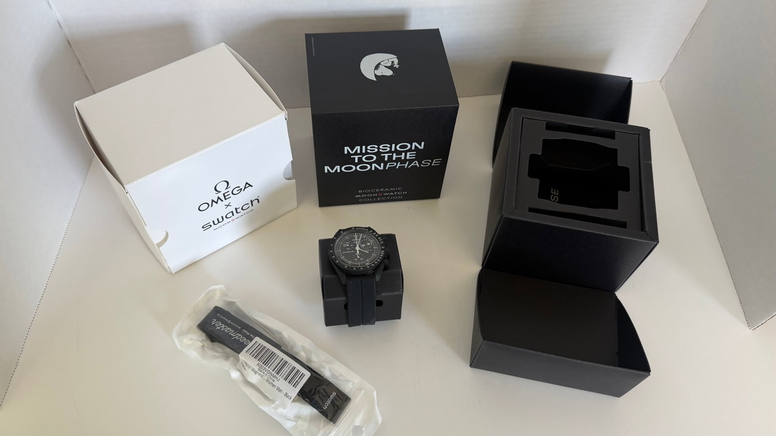 Omega x Swatch Bioceramic MoonSwatch "Mission to the Moonphase" – Snoopy Edition: Celebrate celestial charm with this collector's edition Omega x Swatch MoonSwatch; Mission to the Moonphase, a whimsical yet horologically inspired collaboration that blends the iconic Speedmaster des