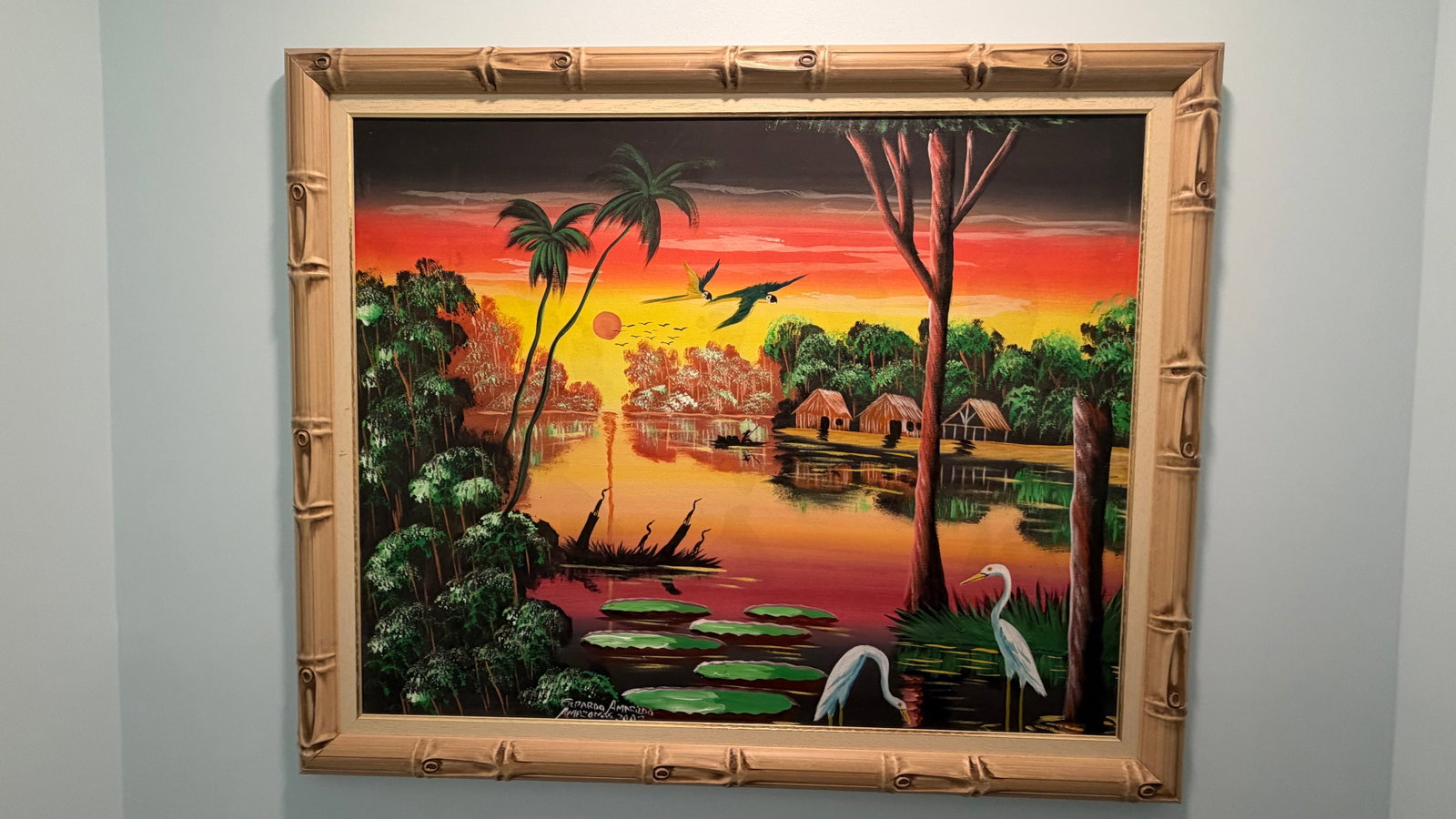 Tropical Sunset Village; Original Caribbean Landscape Painting: Immerse yourself in the tranquil beauty of island life with this vibrant, hand-painted tropical landscape. Capturing a glowing sunset over a river village, this artwork showcases lush palm trees, sere
