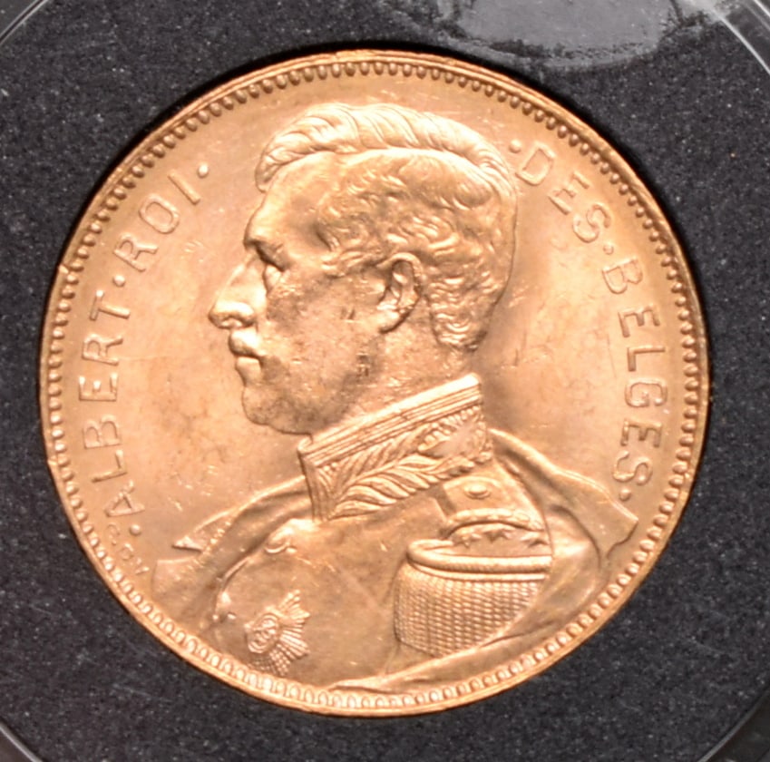 1914 20 F. Belgium Albert Roi Gold Coin, 0.1867 Troy Oz. Fine Gold: MS63 according to sticker on capsule. Please read “Auction Details” / “Terms of Sale” for preview, payment, pickup, shipping and other instructions. Lot includes the item(s) de