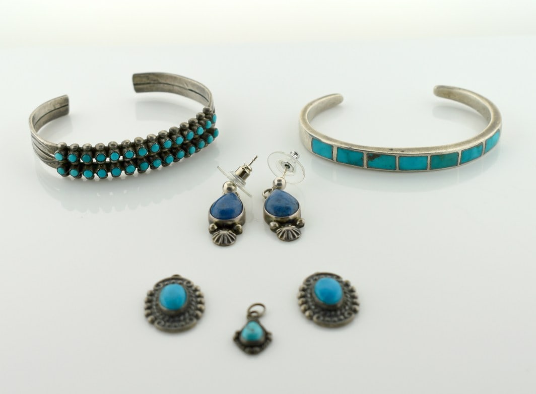 Collection of Southwestern Sterling Jewelry: Turquoise Cuff Bracelets and Pendants & Lapis Earrings: In good condition. Please read “Auction Details” / “Terms of Sale” for preview, payment, pickup, shipping and other instructions. Lot includes the item(s) described in the titl