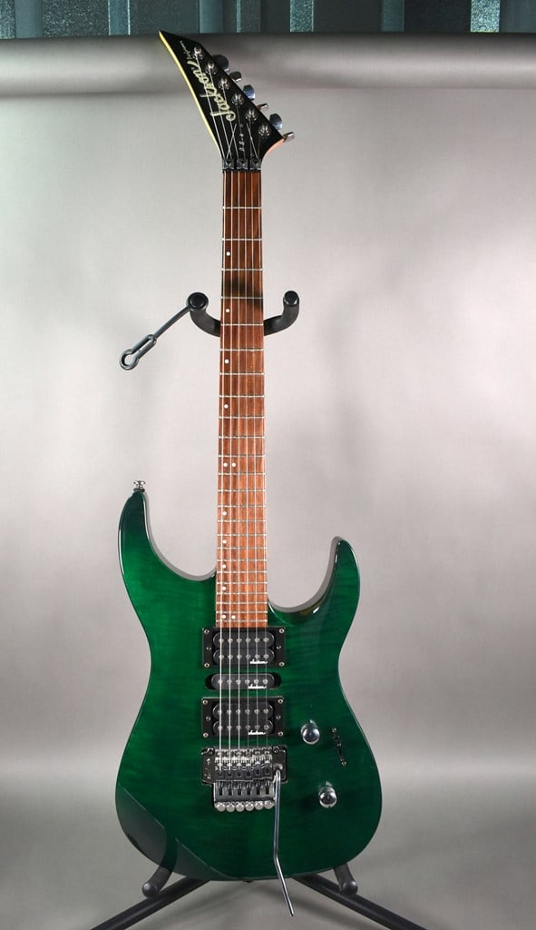 Vintage 1998 Jackson Performer PS4 Electric Guitar with Green Flame Finish: Excellent condition. Has a Humbucker/Single Coil/Humbucker pickup layout and a Floyd Rose double-locking tremolo system. Has a reverse headstock. Serial no. is 9815???. Please read “Auction Deta