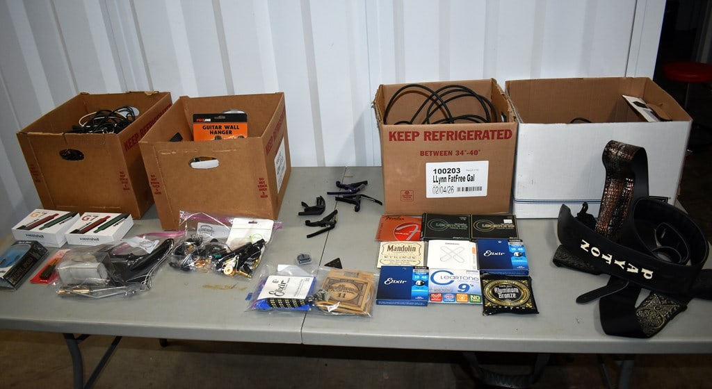 Large Lot of Guitar Gear, Paraphernalia and Parts: Includes cables, wireless transmitters, wall brackets, strings, capos, straps, picks, plugs, and a few replacement parts. Please read “Auction Details” / “Terms of Sale” for