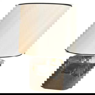 1980s Mid-Century Modern Oval Steel Table Lamp by Tommaso Barbi: This is a 1980s steel oval table lamp designed by Tommaso Barbi, a renowned Italian designer known for his sophisticated and luxurious creations. The lamp features a polished steel base in an elegant