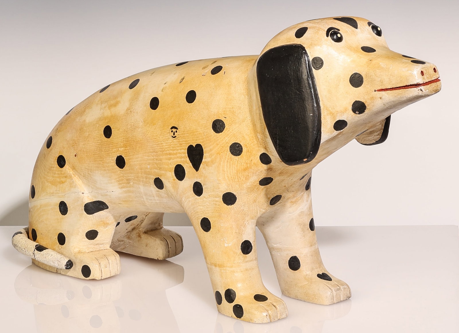 E.W. Riley (20th c.) "DOG" Folk Art Sculpture: E.W. Riley (20th c.) "DOG", Carved and Painted Wood Sculpture, signed. Size: 12.5'' x 23'' x 6'' (32 x 58 x 15 cm). A similar Dog sculpture by Riley was included in the 2022 exhibition An Unnatural Hi