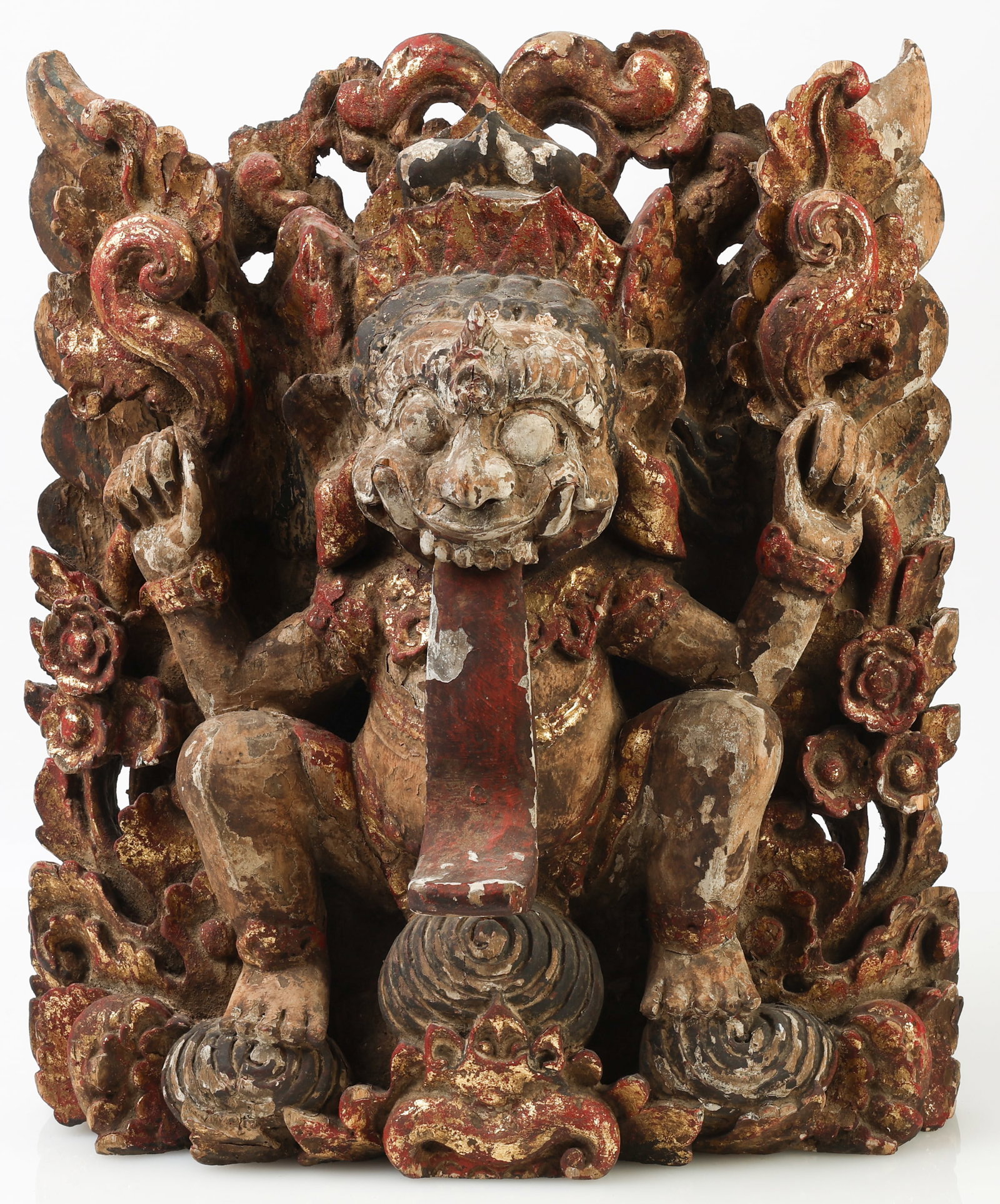 Antique Balinese Rangda Sculpture: Antique Balinese Rangda Sculpture, carved wood, gilt and pigments. Size: 16.5'' x 14.5'' x 7.5'' (42 x 37 x 19 cm).