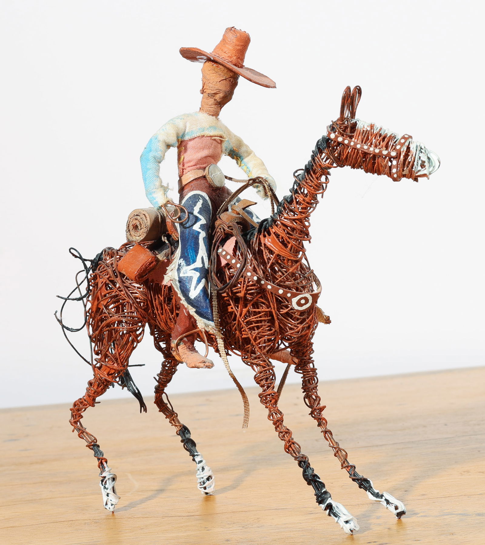 Johnny Young (Indigenous Australian, 20th c.) Cowboy: Johnny Young (Australia, 20th c.) Cowboy, 2004, Copper Wire and Mixed Media Sculpture by the Aboriginal artist of the Titjikala community. Provenance: Private New York City Estate. Size: 7.5'' x 7.5''