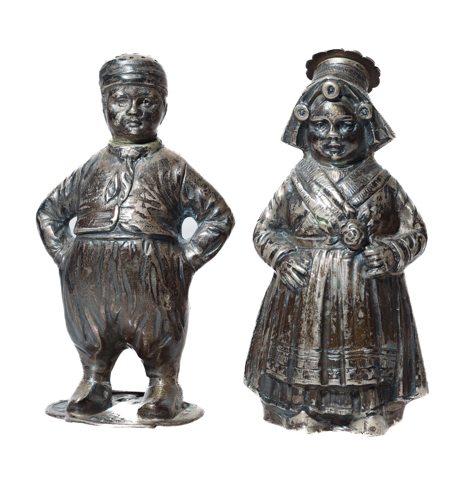 Antique Dutch Silver Salt & Pepper Shaker Set: Antique Dutch Silver Salt and Pepper Shaker Set of a Boy & Girl in traditional dress. Size: 3.75'' x 2'' x 1.5'' (10 x 5 x 4 cm).