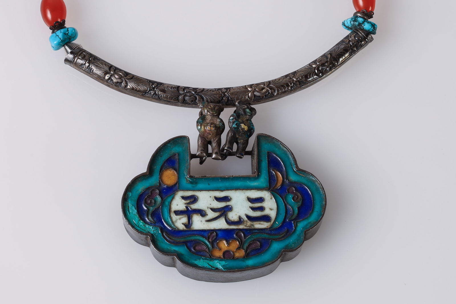 Chinese Silver Enamel Lock Necklace: Vintage Chinese Silver Enamel Lock Necklace. The pendant is in the shape of a "long life lock" (chang ming suo) and features vibrant enamel work (3" W, 8 cm); The necklace is strung with various beads