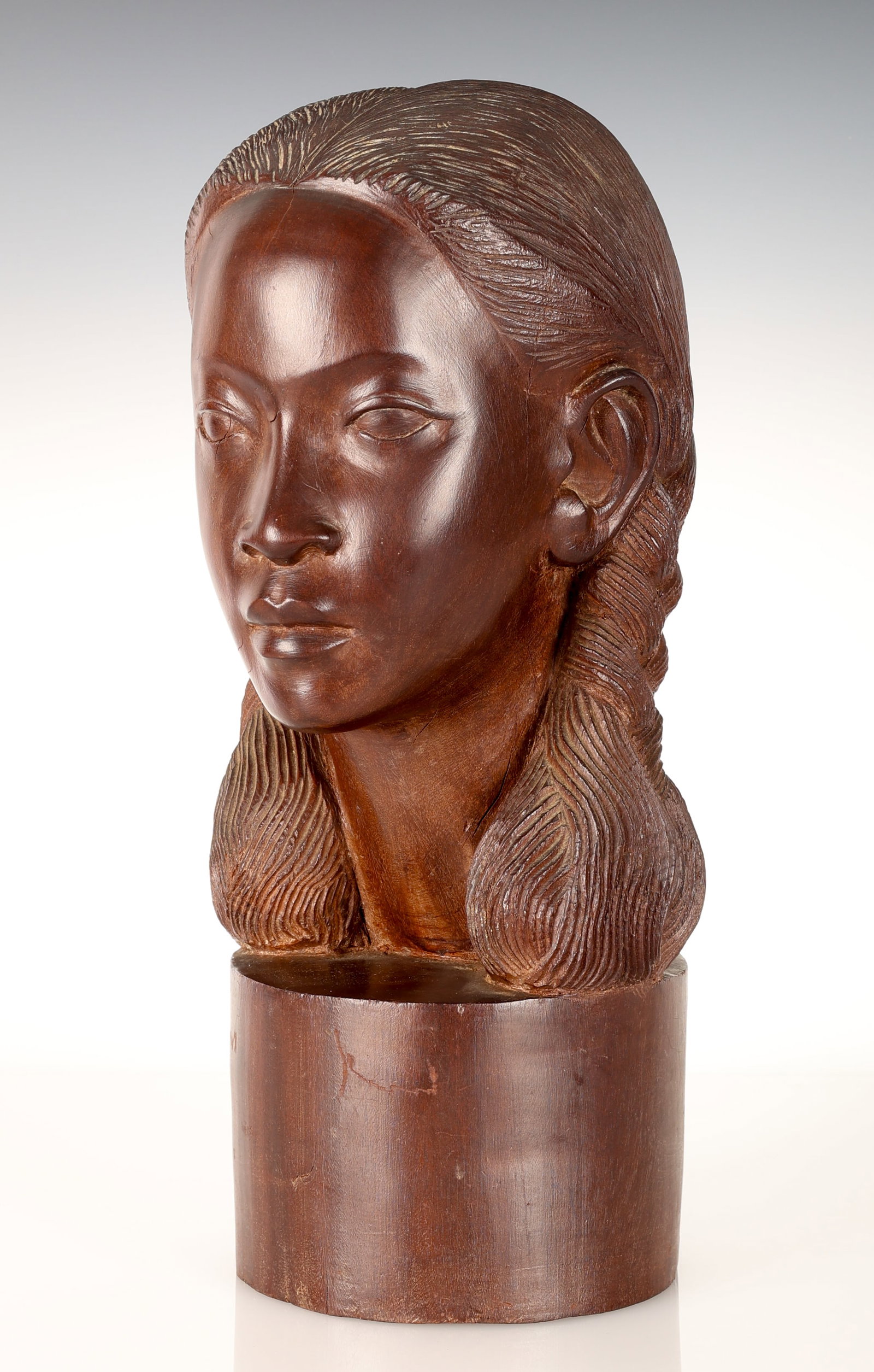 Salomon (1900-1990) "Bust of a Woman": Harald Salomon (Danish, 1900-1990) "Bust of a Woman", 1947, Carved hard wood bust, signed and dated. Size: 15'' x 7'' x 7'' (38 x 18 x 18 cm).