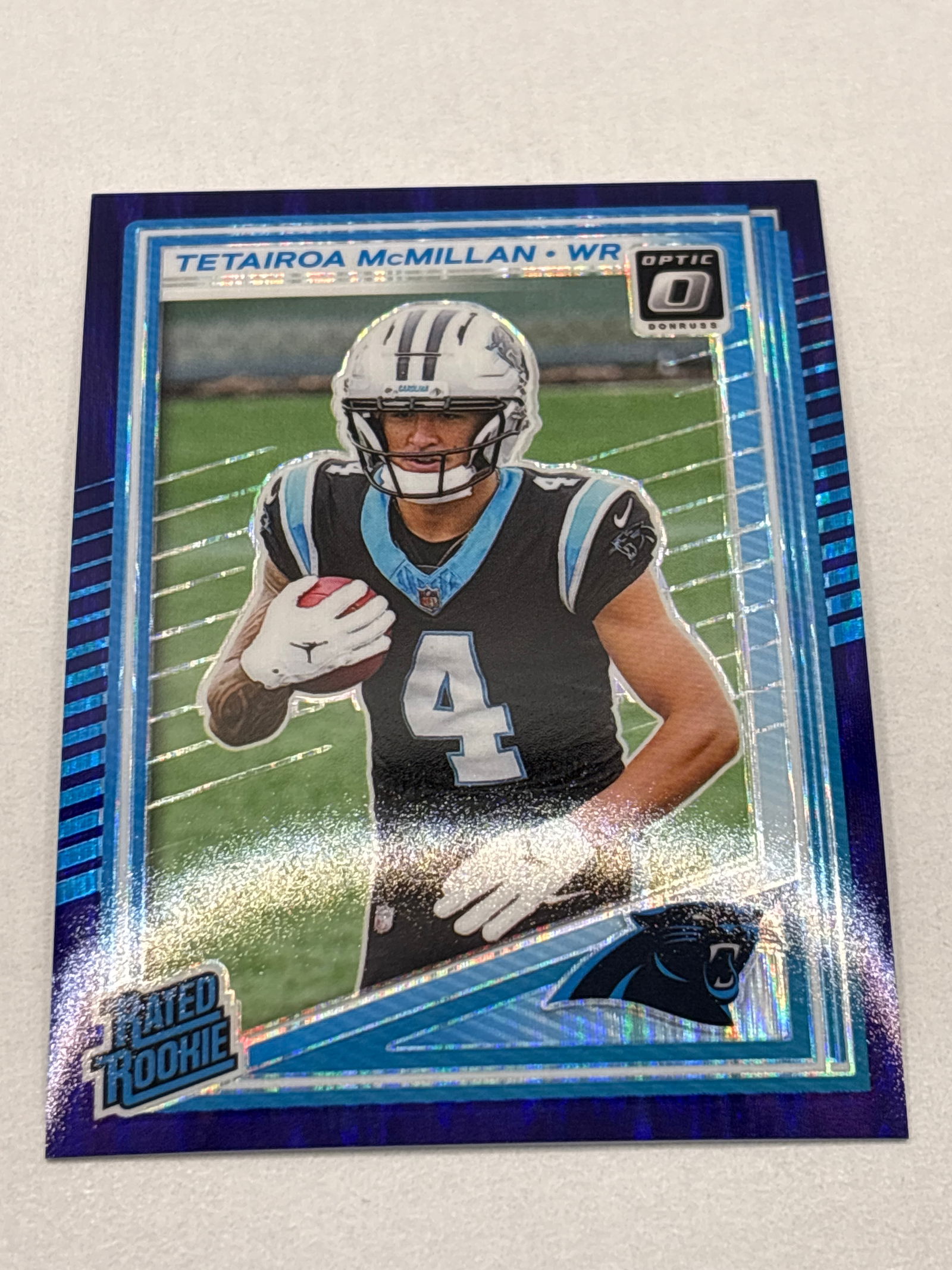 2025 PANINI DONRUSS OPTIC TETAIROA MCMILLAN PURPLE SHOCK PRIZM HOLO RATED ROOKIE CARD: THE HOBBY BOX