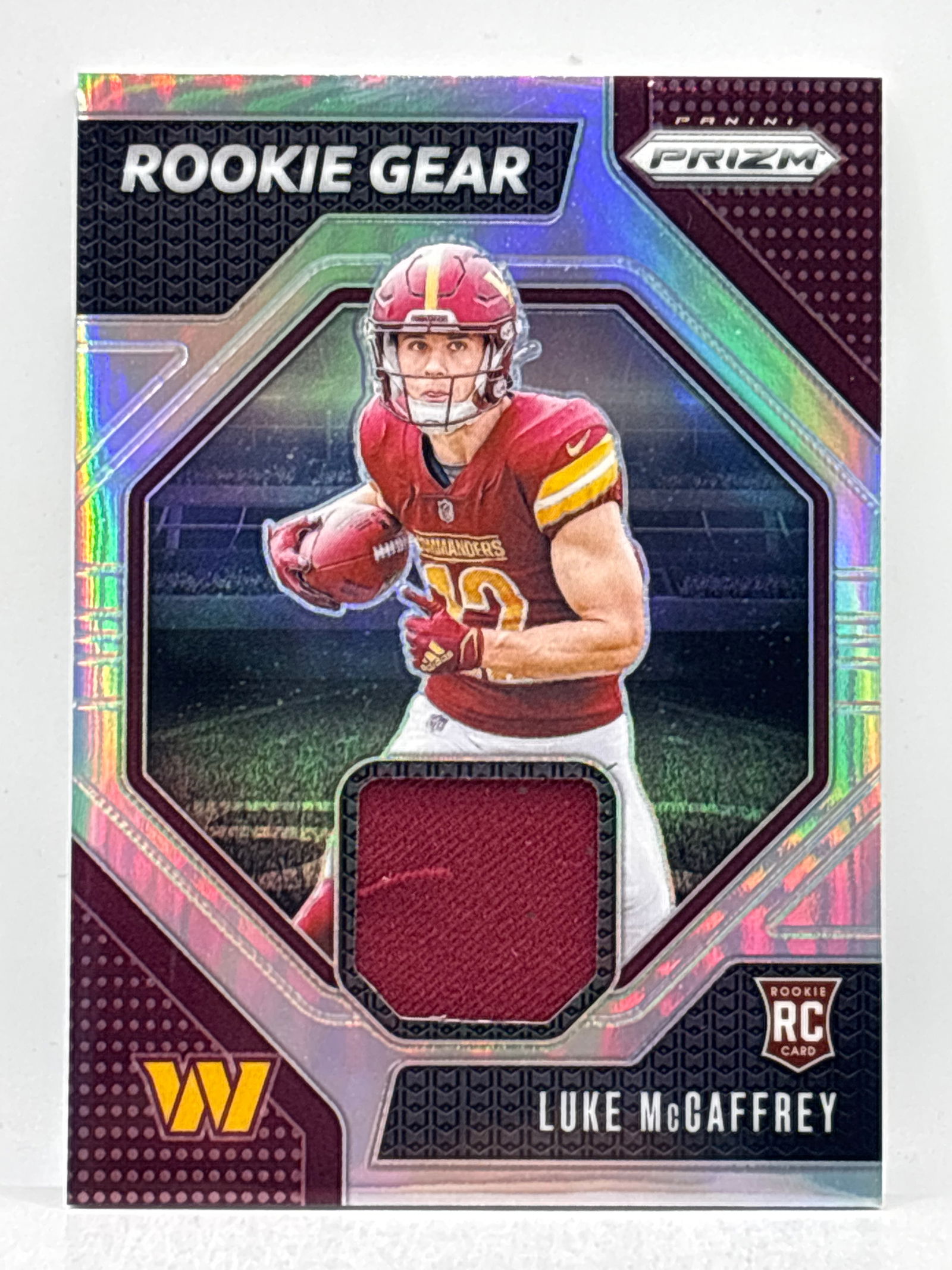 2024 PANINI PRIZM LUKE MCCAFFREY PRIZM HOLO ROOKIE GEAR ROOKIE PATCH: THE HOBBY BOX