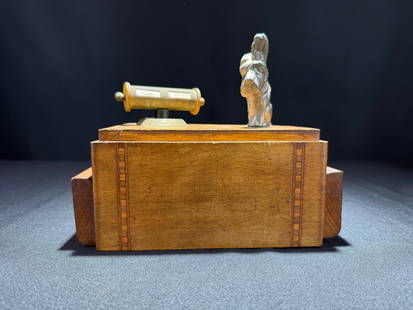 Art Deco Wooden Cigarette Dispenser with Scottie Dog and Calendar, circa 1930s: A finely crafted wooden cigarette box featuring an inlaid marquetry border design and chrome colored Scottie dog and calendar finials. The three-tier interior compartment system allows for organized c