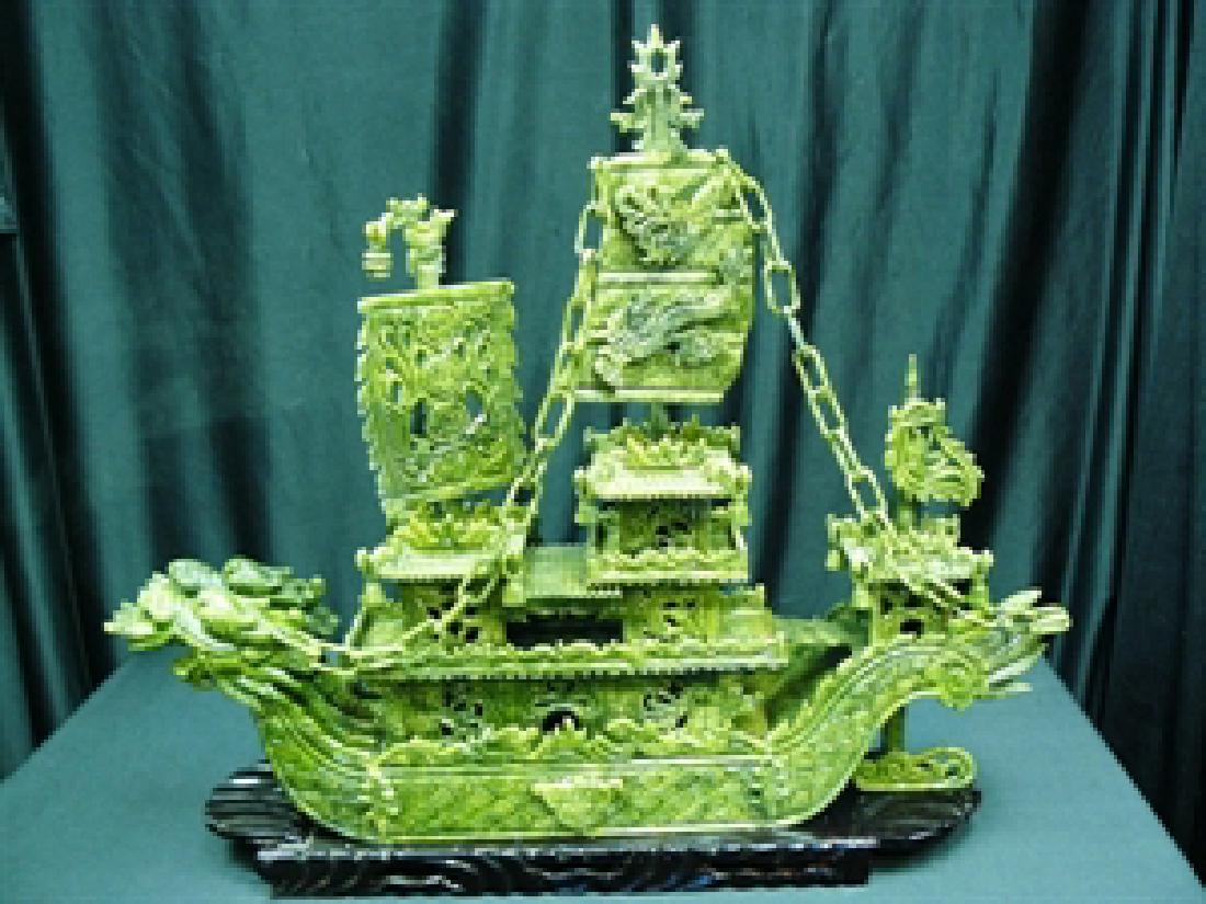 24" GREEN JADE DRAGON BOAT: This jade boat is made from natural green jade. It consists of boat body, chains, sails, flag, anchor, rudder, and wooden base. Very detailed carving. LENGTH: 24", HEIGHT: 24", WIDTH: 6".
