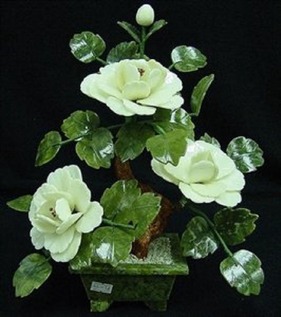 REAL WHITE JADE BONSAI FLOWER: This flower is made of real white jade. The leaves are made of Taiwan jade, dark green, as well as the pot. The branches can be bend over, so you can adjust it the way you like. L: 12", W: 8", H: 13".