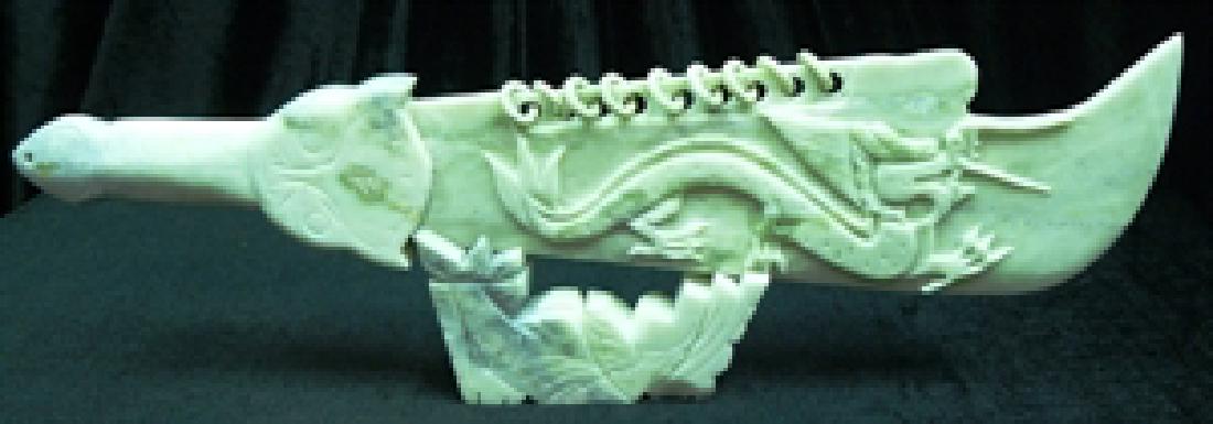 REAL JADE 9-RING DRAGON SWORD SET: Wide: 22", Deep: 2", High: 7". This is a jade sword set, carved from one solid piece of jade, the base is separate. 9-ring is the highest ranking in ancient China for Warriors. There is a dragon carve