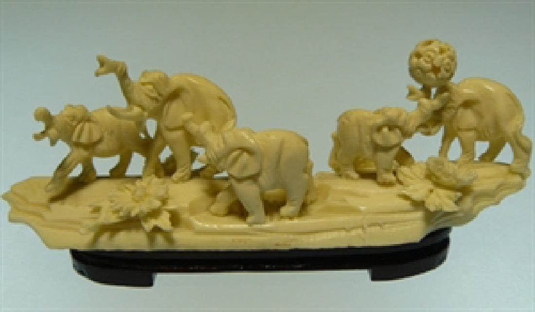 HAND CARVED BONE ELEPHANTS JUNGLE: This Elephants Jungle is made from COW BONES. All natural and all hand carved from one solid piece of bone. It is not bone powder, resin or mouded. Very detailed carving. Size: Long: 6", Wide: 2", Hig