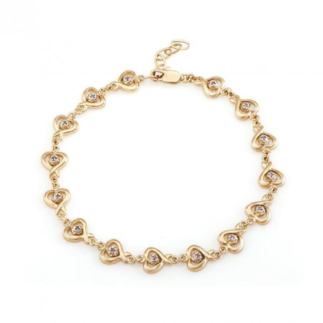 0.69 CT Diamond Designer Hearts Bracelet $1,375.00!: 15 Single cut 0.09 mm round diamonds.Color: I & Clarity: SI2, No treatment. 11.44 grams of silver layered with 18K yellow Gold. Length is 7 1/2 inches. The width is 1/4 inches.