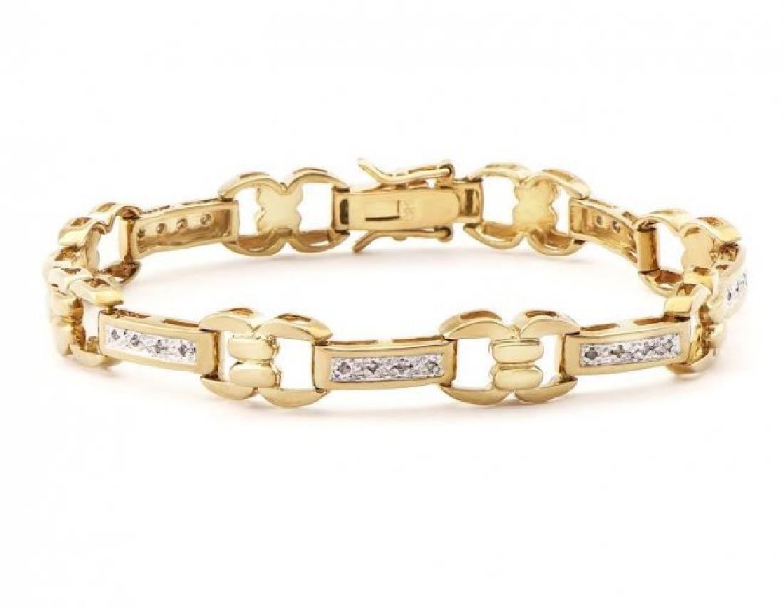0.78 CT Diamond Designer Bracelet MSRP $1,585.00!: 21 Single cut 0.9mm round diamonds Color: I & Clarity: SI2 No treatment. 11.5 grams of silver layered with 18k yellow gold. Length is 7 1/2 inches. The width is 1/4 inches.