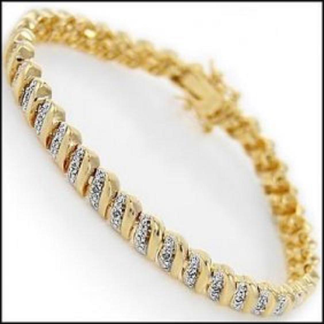 1.75 CTW Diamond Tennis Bracelet: Master jewelers designed your bracelet with 39 single cut diamonds 1.75 carat tw. 11.4 grams of sterling silver layered with 18K Gold. Length is 7 1/2 inches.