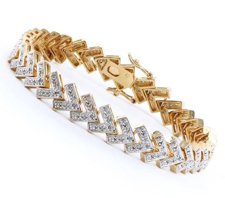 1.23 CT Diamond Designer Bracelet MSRP $2,340: 135 Single cut diamonds Color: I & Clarity: SI2 No treatment. 11.89 grams of sterling silver layered with 18K yellow Gold. Length is 7 1/2 inches. The width is 1/4 inches. This lovely bracelet comes i