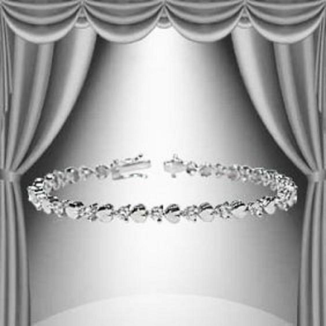 1.23 CTW Diamond and Hearts Silver Tennis Bracelet: Master jewelers designed your bracelet with 21 single cut diamonds 1.23 carat tw. 11.4 grams of sterling silver layered with 18K White Gold. Length is 7 1/2 inches.