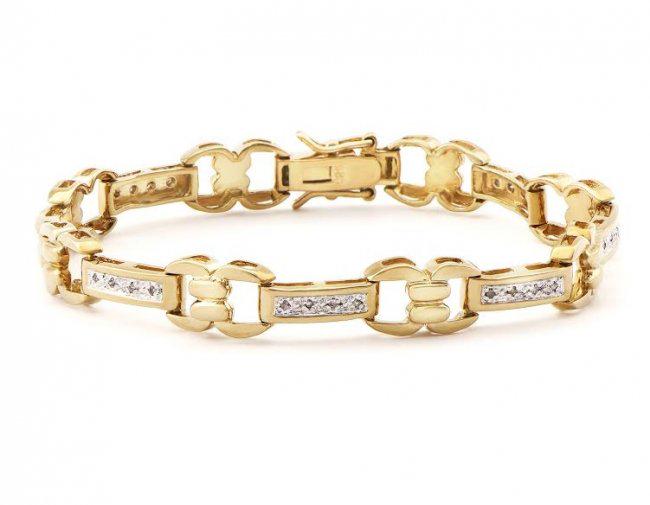 0.78 CT Diamond Designer Bracelet MSRP $1,585.00!: 21 Single cut 0.9mm round diamonds Color: I & Clarity: SI2 No treatment. 11.5 grams of silver layered with 18k yellow gold. Length is 7 1/2 inches. The width is 1/4 inches.