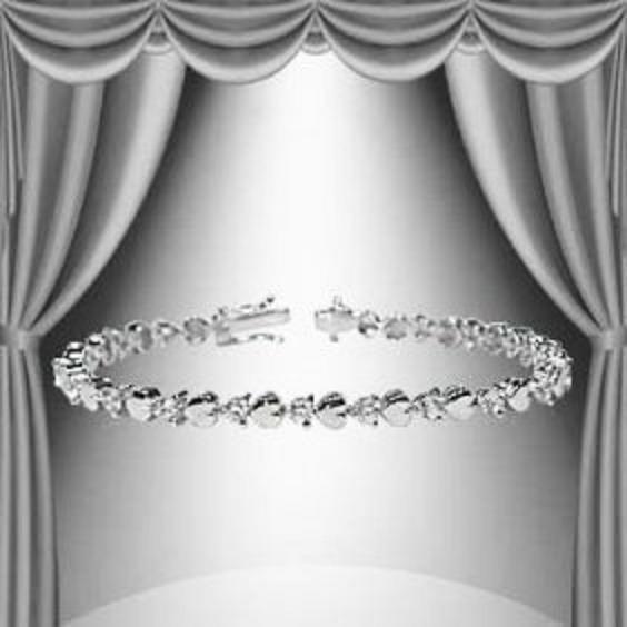 1.23 CTW Diamond and Hearts Base Metal Tennis Bracelet: Master jewelers designed your bracelet with 21 single cut diamonds 1.23 carat tw. 11.4 grams of Base Metal layered with 18K White Gold. Length is 7 1/2 inches.