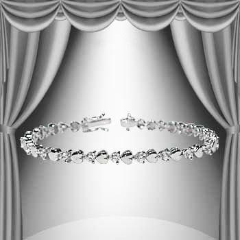 1.23 CTW Diamond and Hearts Base Metal Tennis Bracelet: Master jewelers designed your bracelet with 21 single cut diamonds 1.23 carat tw. 11.4 grams of Base Metal layered with 18K White Gold. Length is 7 1/2 inches.